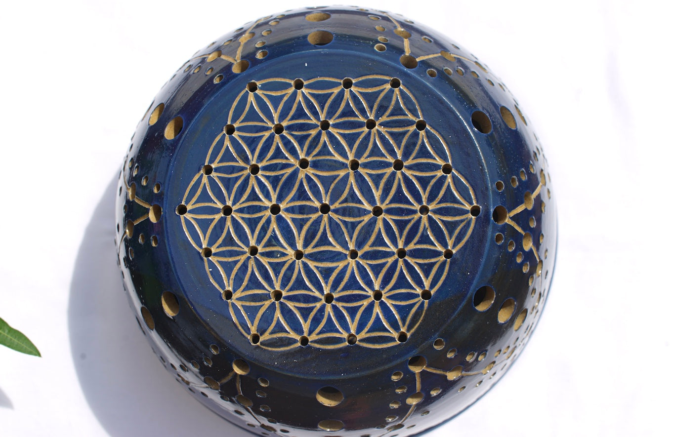 Blue tealight dome with flower of life at the top