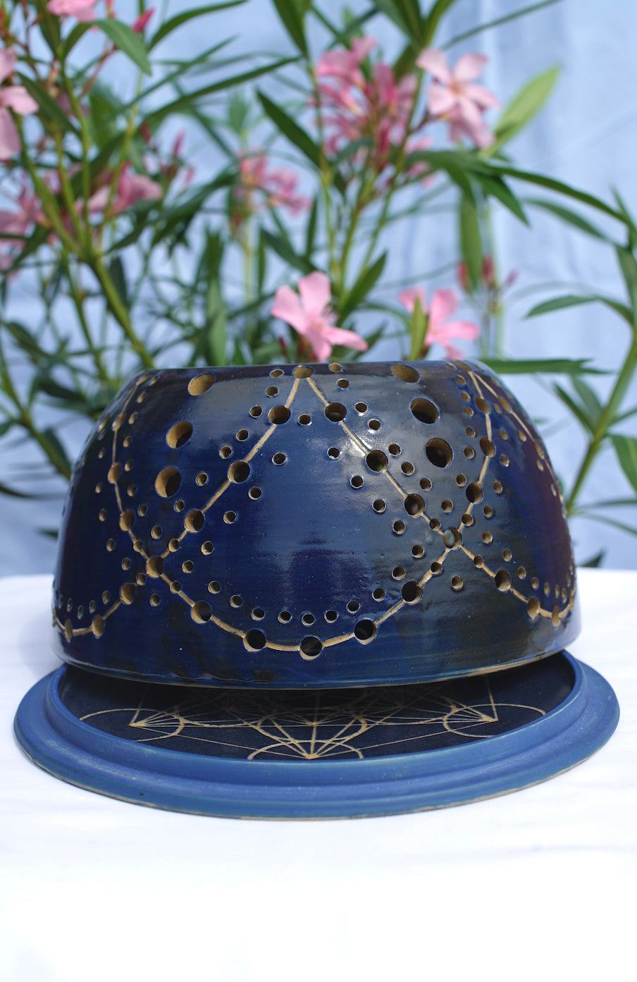 Blue tealight dome with flower of life at the top