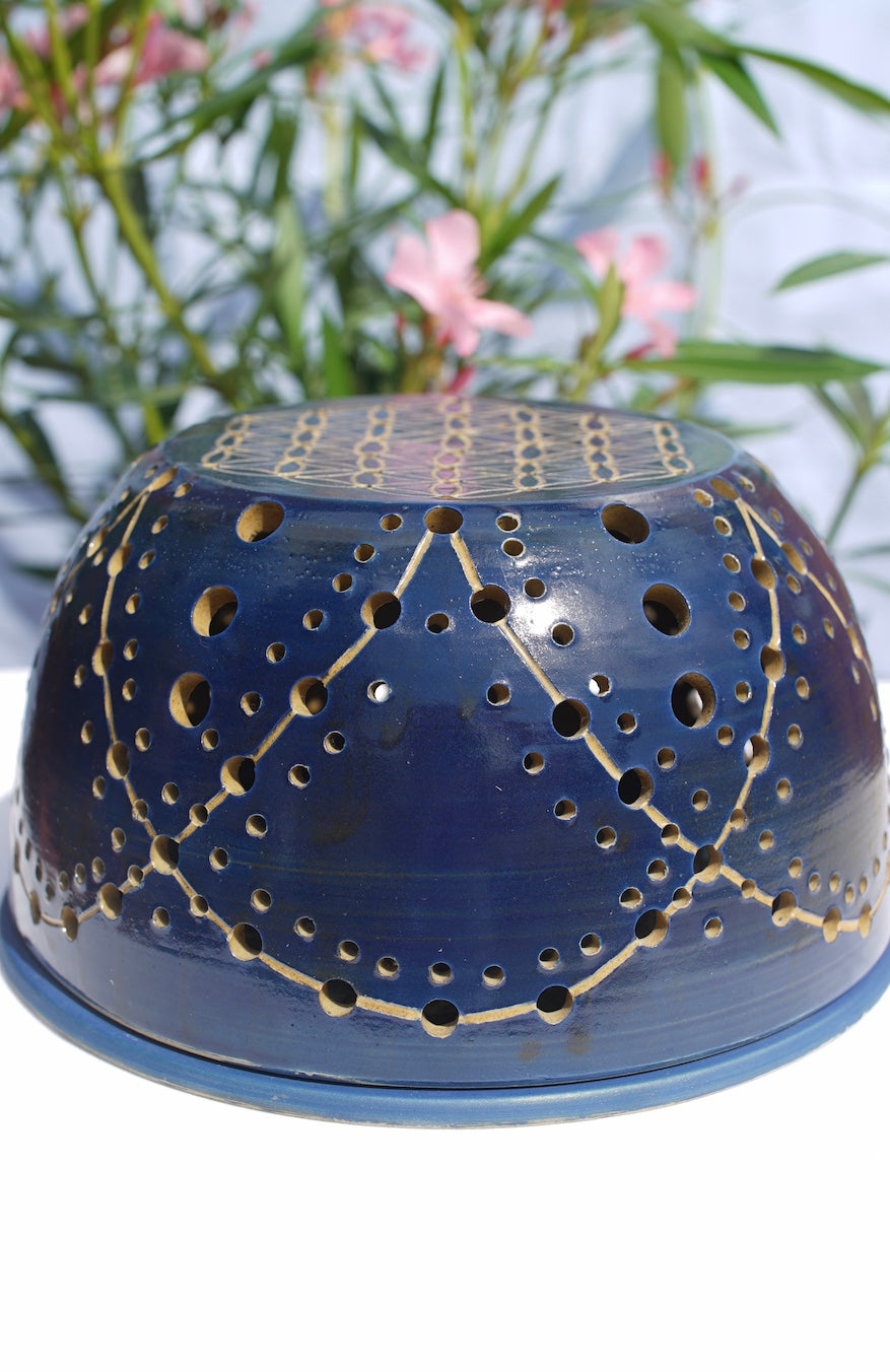 Blue tealight dome with flower of life at the top