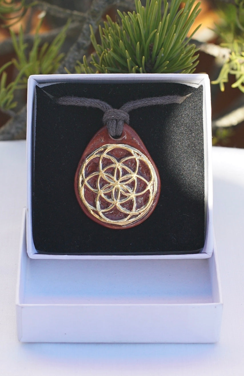 Amulet cinnamon seed of life and flower of life in 24 carat gold