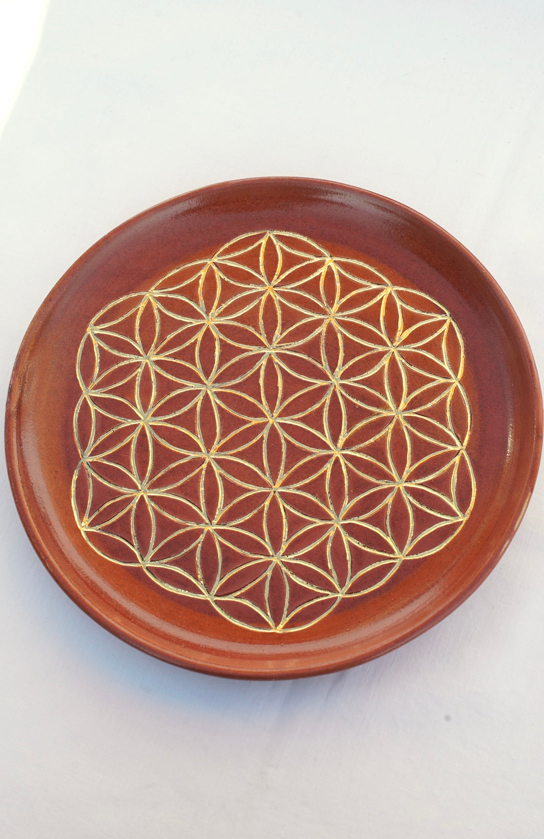 Cinnamon plate with flower of life 24 carat gold